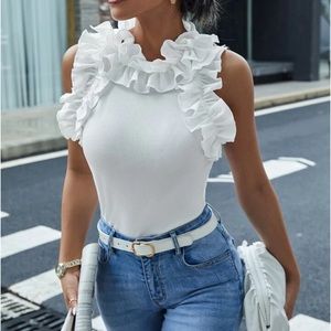 White ruffle bodysuit. Size medium. Brand new with the tags.